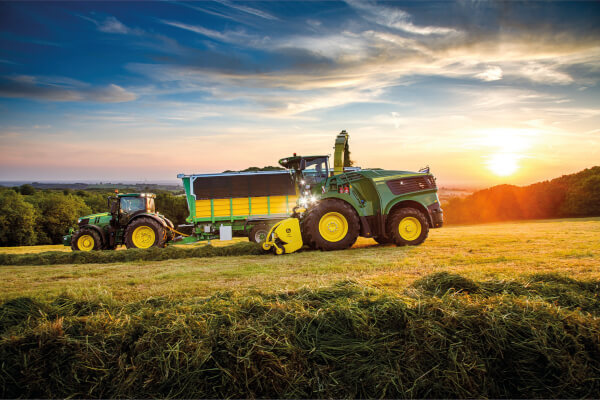 Tractor harvesting grass